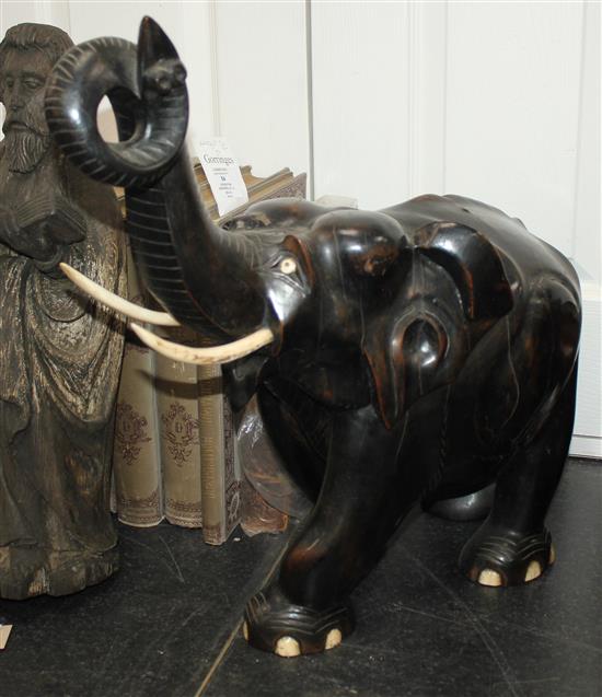 A large Indian ebonised carved hardwood elephant, 21in.